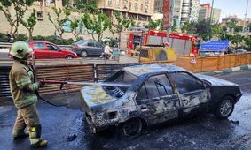 آتش‌سوزی یک خودرو در بزرگراه مدرس تهران؛ ۲ سرنشین مصدوم شدند